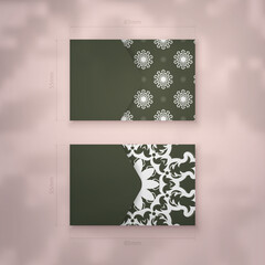 Business card in dark green with vintage white pattern for your business.