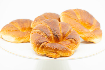 Obraz na płótnie Canvas Detailed close up of delicious buttery plain croissants