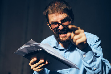 funny business man with a tablet in his hands internet