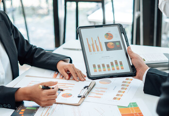 Teamwork process, business people working in the office discussing documents and ideas at meeting