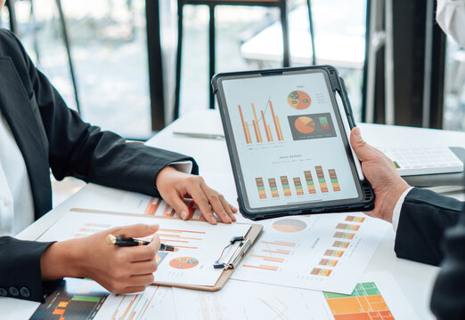 Teamwork process, business people working in the office discussing documents and ideas at meeting