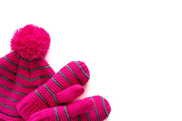 Set of hat and mittens for child isolated on white background with copy space. Children winter clothes. Accessories for girl