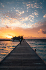 sunset on the beach with bridge