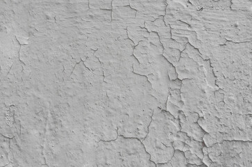 Abstract background from an old gray weather damaged concrete wall.