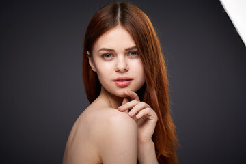 woman with bare shoulders and beautiful hairstyle close-up attractive look