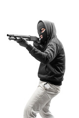 Criminal man in hidden mask pointing the shotgun