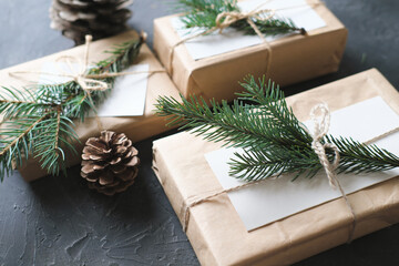 minimal style christmas wrapping of gifts. paper present decor. eco gifts with natural fir tree...