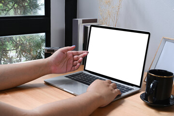 Young female working online with computer laptop at home.