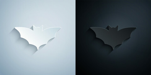 Paper cut Flying bat icon isolated on grey and black background. Happy Halloween party. Paper art style. Vector