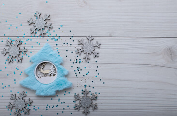 Christmass flatlay christmas tree with blue fur and silvery snowflakes