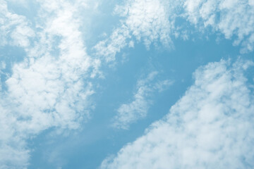 White clouds with blue sky in a sunny day, Pastel colour of sky with  a little puffy floating clouds