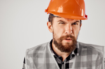 emotional man in orange hard hat construction professional Studio