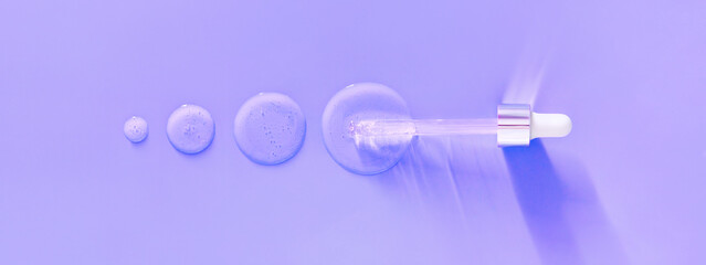 banner pipette drops of serum on purple neon background	
