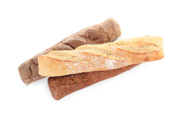 Different tasty baguettes on white background, top view. Fresh bread