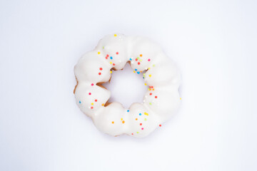 White donut with topping on white background.