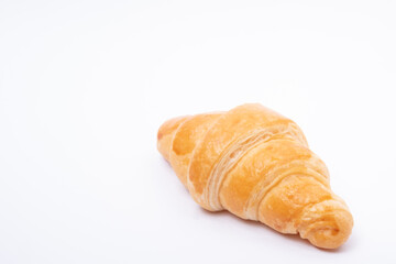 Croissant on a white background. Bread and copy space.