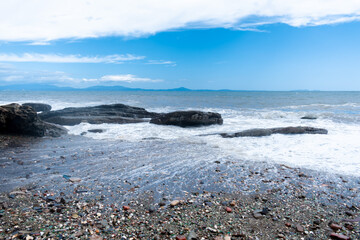 Sea waves hitting the rock. Concept of respect for nature. Copy space.