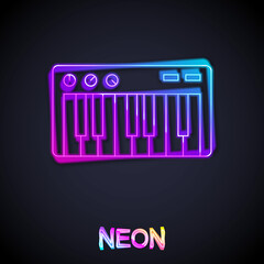 Glowing neon line Music synthesizer icon isolated on black background. Electronic piano. Vector