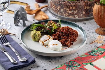 Portion of appetizing quinoa salad with eggs and avocado