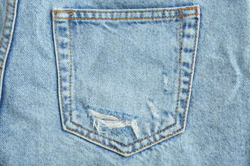 Stylish light blue jeans, closeup of back pocket