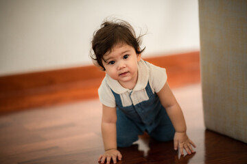 Naklejka premium happy son child baby playing at home by supporting with family father and mother