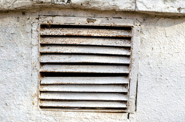 metal grilles of old ventilation, painted with white paint