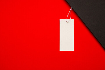 Black Friday. White tag on a red and black background