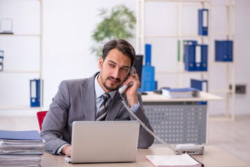 Young businessman employee working in the office