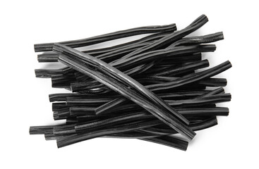 Pile of tasty liquorice candies on white background, top view