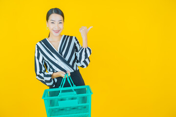 Portrait beautiful young asian woman smile with grocery basket