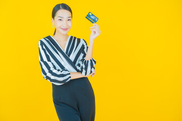 Portrait beautiful young asian woman smile with credit card