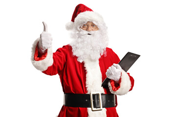 Santa Claus holding a clipboard and gesturing a thumb up sign