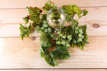 Grape and wine on table