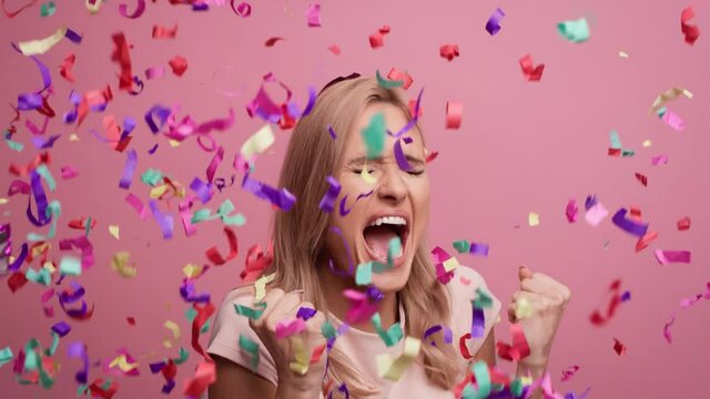 Happy woman showing winning sign. Shot with RED helium camera in 8K  