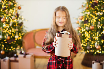 Little girl with Chritmas present.