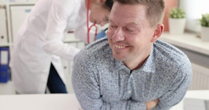 Young man at medical appointment with proctologist slow motion 4k movie