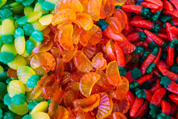 Colorful gummy sweets in the store. Background from sweets