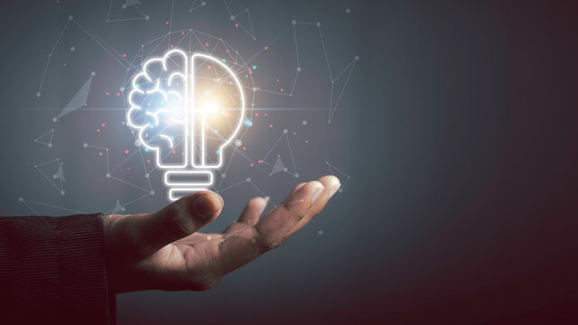 Hand holding light bulb half brain, Smart thinking inspiration idea innovation brainstorm and imagination concept.