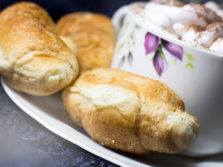 Croissants with strawberry jam so close