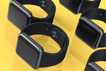 Mockup of smart watches or fitness tracker lying on yellow background.