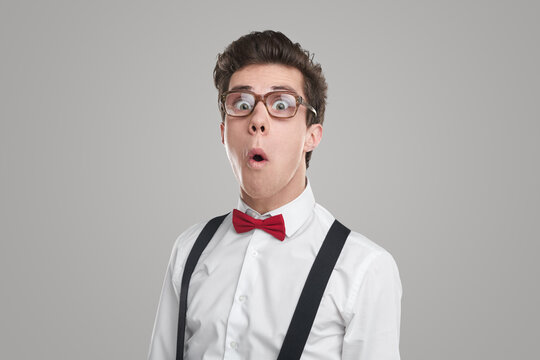 Amazed nerd man in glasses
