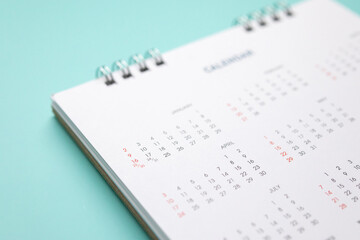 calendar page on blue background business planning appointment meeting concept