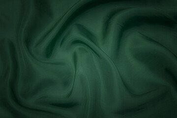 Texture, background, pattern. Texture of green silk fabric. Beautiful emerald green soft silk...