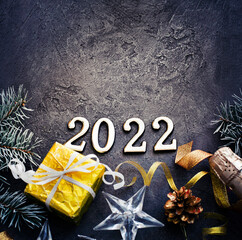 happy new year 2022  background new year holidays card with bright lights,gifts and bottle of...