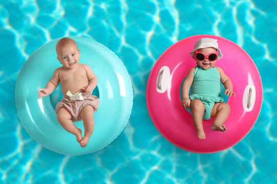 Cute little babies with inflatable rings in swimming pool, top view