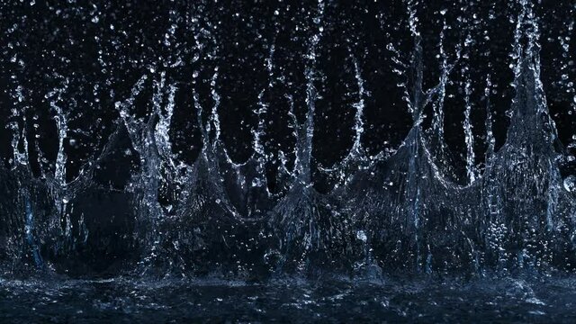 Super Slow Motion Shot of Linear Water Splash at 1000fps on Black Background.