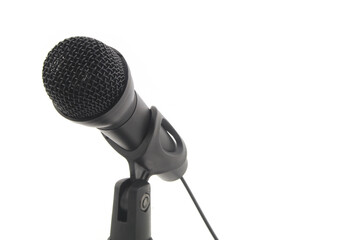 Black microphone isolated on white background, copy space for text.