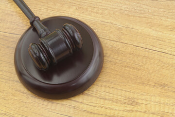 Wooden judge gavel on table close up. Court and justice concept.