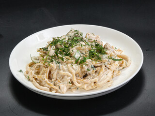 Spaghetti with cream sauce and herbs