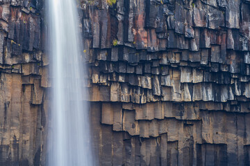 Svartifoss waterfall long exposure closeup in Iceland
